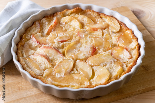 french apple dessert clafoutis in a baking dish