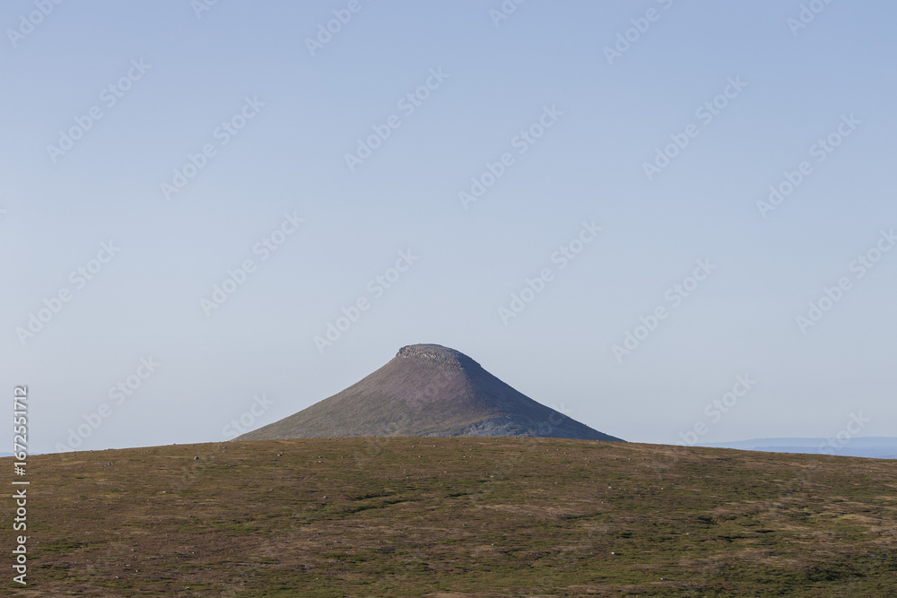 Fototapeta premium Single mountain peak in vast landscape