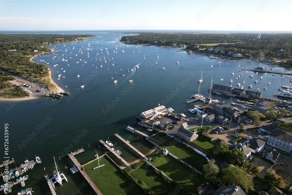Fototapeta premium Aerial view of a bustling harbor with boats and yachts
