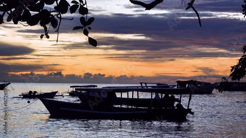 Pleasure boats at Bunaken Island Roadstead, Sulawesi, Sulawesi Sea at sunset