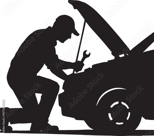 Silhouette of a mechanic kneeling and working on a car engine with a wrench repair