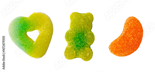Colorful gummy candy set in bear, heart, and orange slice shapes with sugar and sour coating isolated on transparent for halloween trick or treat concept.
