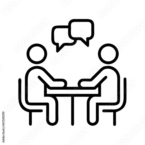 Two people sitting at a table in discussion with speech bubbles icon