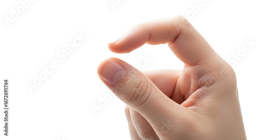 A close-up shows a fair-skinned hand gently pinching something small, fingers delicately curved.