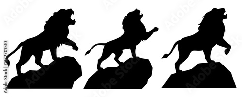 silhouette of a roaring lion standing on a rock
