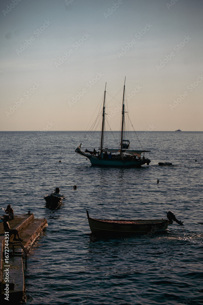 Fototapeta premium Vibrant photos of Cinque Terre featuring Italian beaches, boats on the Mediterranean, bikini lifestyle, coastal towns, colorful villages, and summer vacations