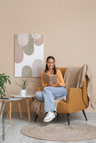 Young woman reading book an...
