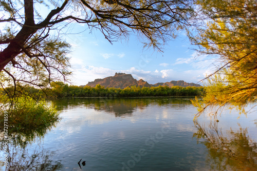 reflection of the red mountain over the salt river in arizona