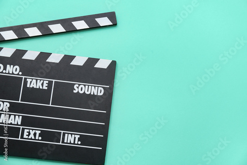 Movie clapper on turquoise ...