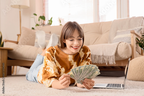 Young woman with dollar ban...