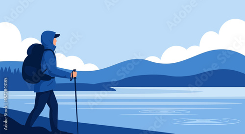 Hiker Enjoys Serene Waterside Scenery During Outdoor Adventure in Shades of Blue