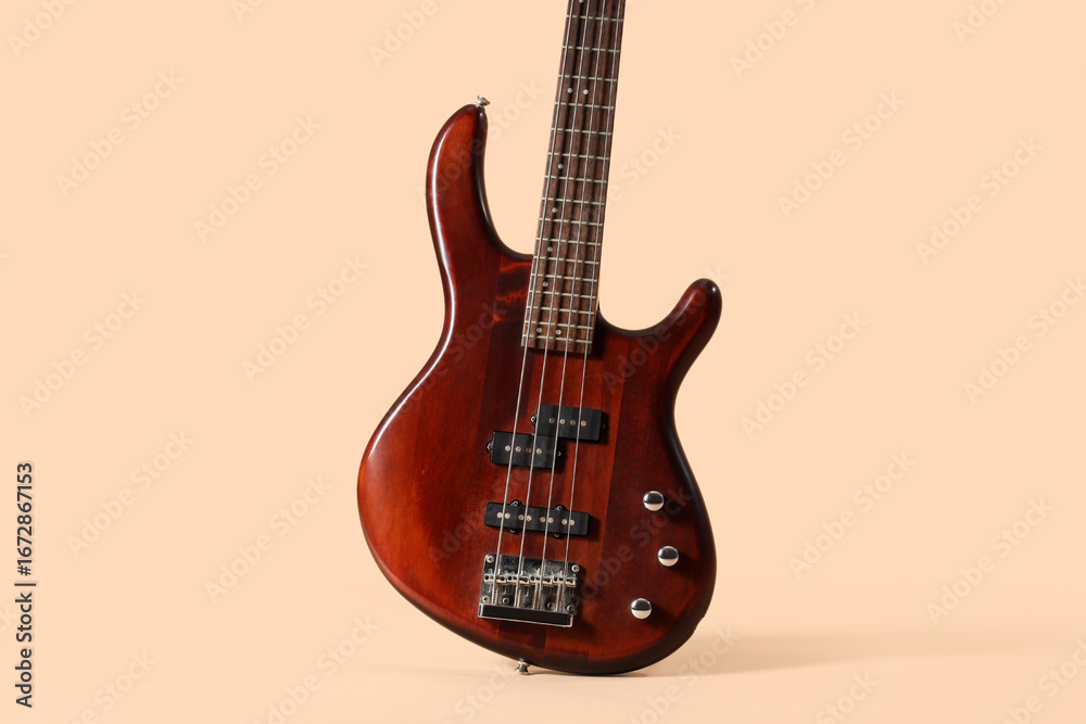 Fototapeta premium Brown electric guitar on beige background