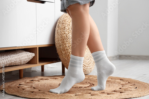 Legs of woman in white sock...