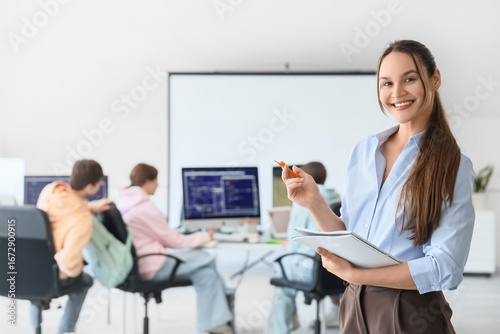 female teacher with noteboo...