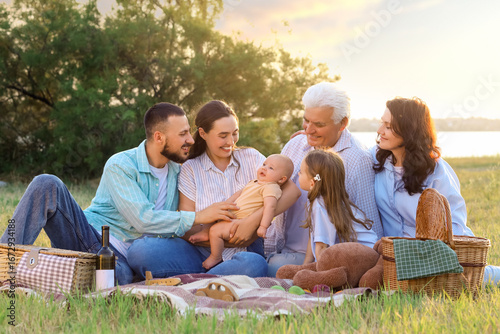 Portrait of big family on picnic in park