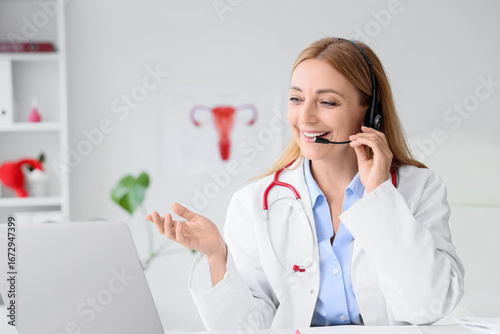 Female gynecologist with he...