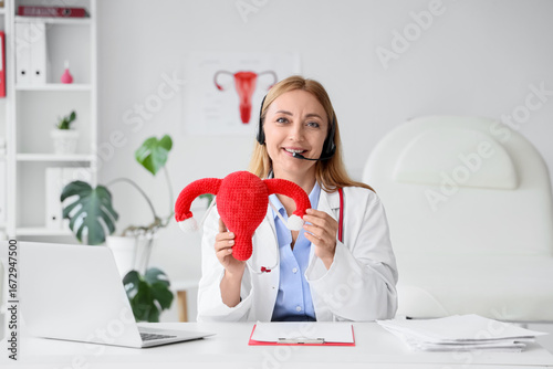 Female gynecologist with kn...