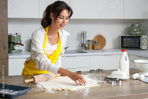 Young woman making cookies ...