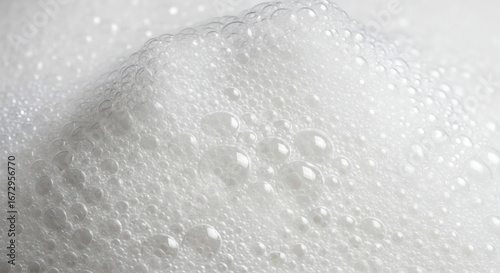 A close up view of a mass of white bubbles with varying sizes and shapes creating a dense texture
