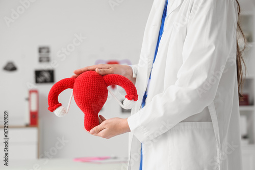 Female gynecologist with kn...