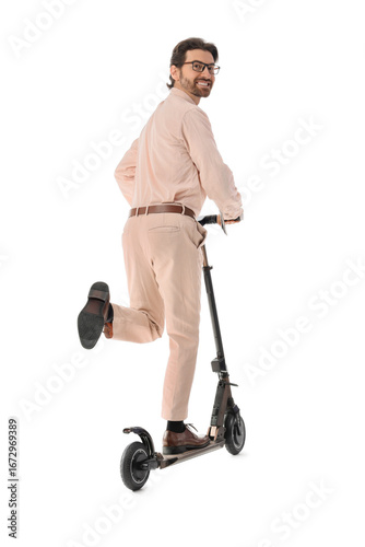 Handsome businessman riding...