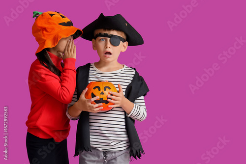 Cute girl whispering in boy...