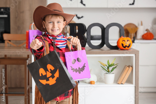 Little boy dressed as cowbo...