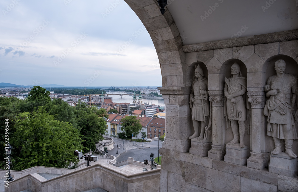 Obraz premium Budapest, Hungary – View of Árpád-era warrior statues in wall niches at Fisherman’s Bastion, Castle District—evoking Hungary’s founding tribes and medieval legacy.