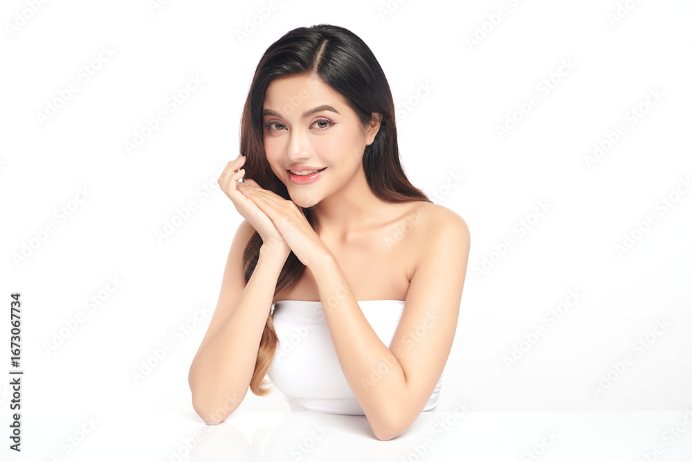 A beautiful young Asian woman with clean, fresh skin against a white background. Skincare, facial treatment, cosmetology, beauty, and spa. An elegant portrait of an Asian woman. A beautiful young Asian woman with clean, fresh skin against a white background. Skincare, facial treatment, cosmetology, beauty, and spa. An elegant portrait of an Asian woman.
