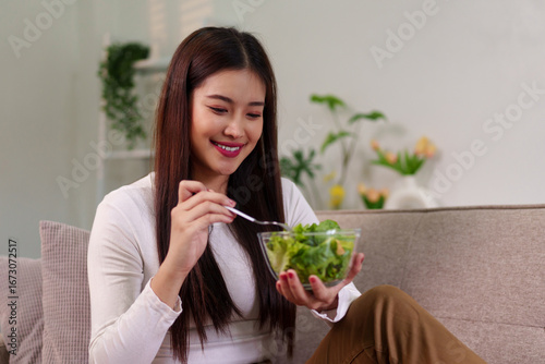 Canvastavla Asian adult woman eating fresh salad happily enjoying nutritious meal healthy li