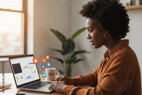 Entrepreneur Plans Digital Marketing Campaign on Laptop