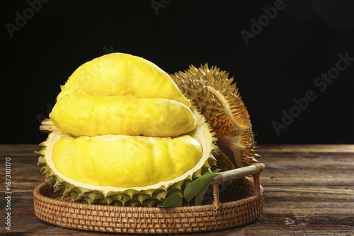 Golden Durian Fruit from Thailand in Wicker Basket on Wooden Table