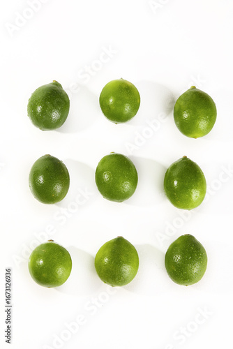 Wallpaper Mural Fresh Green Limes Arranged on White Background - Citrus Fruit Pattern Torontodigital.ca