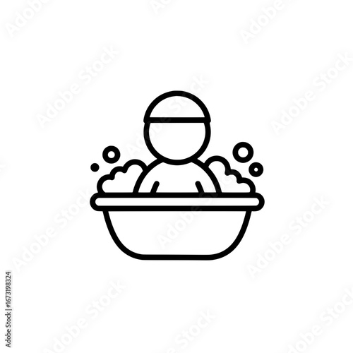 Person relaxing in bathtub with bubbles