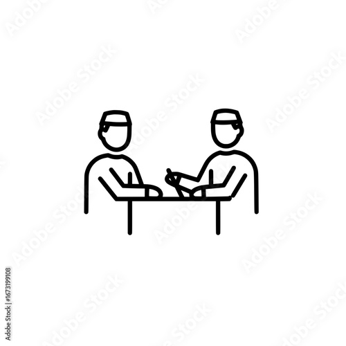 Two people arm wrestling on table