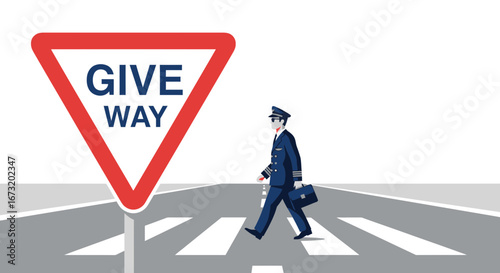 Pilot Crossing Road At Zebra Crossing Near Give Way Sign With Briefcase