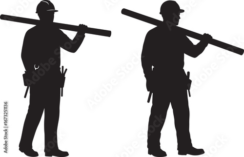 Two construction workers carrying lumber on their shoulders in silhouette