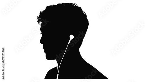 Silhouette of young man listening to music with earphones