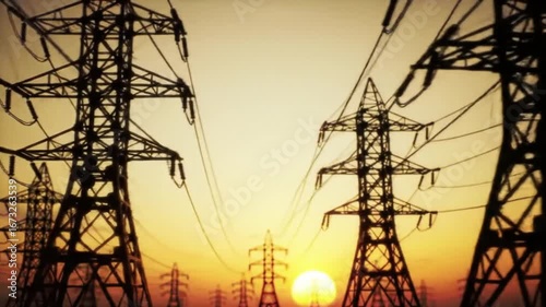 Electric grid pylons at golden sunset