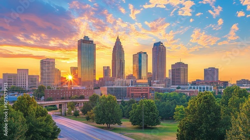 Charlotte skyline at sunset golden hour glow over urban landscape with dramatic clouds