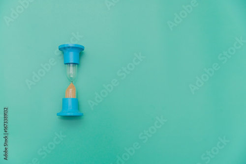Two Minute Hourglass on green Background