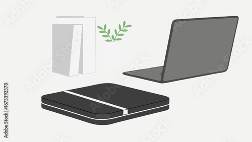Modern Workspace Setup with Laptop and Books.