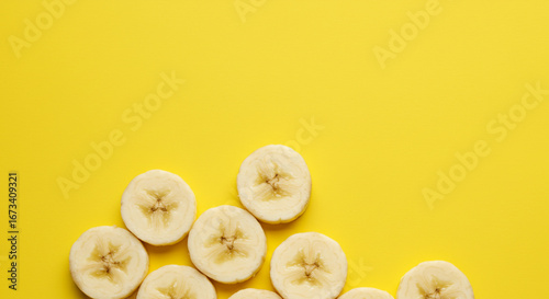 Brighten up your brand with these vibrant banana slices against a sunny yellow backdrop for fresh, healthy designs