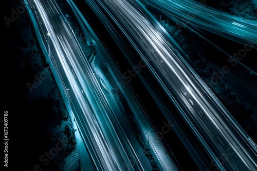 Bright light trails on a dark road at night.