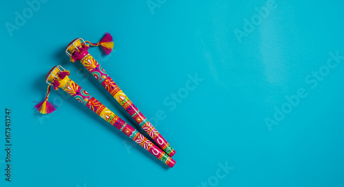 Dandiya Sticks on Blue Background
