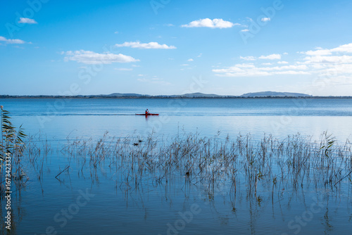 Kayaker paddling on Lake Colac, Victoria, Australia