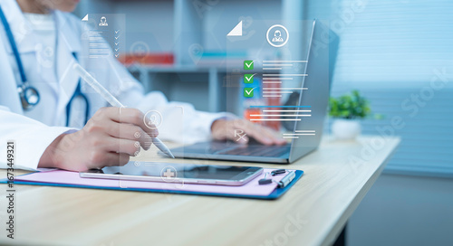Doctor using digital pen with medical interface on tablet and laptop electronic health record data management smart healthcare technology
