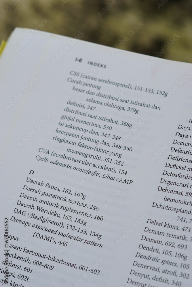 Obraz premium A close-up of an open medical textbook, showing detailed text and diagrams about human physiology and biology. This image represents study, education, research, and the journey of a medical student.