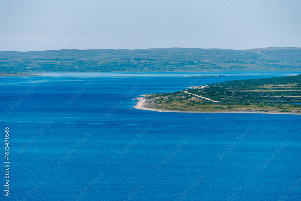 Naklejka premium landscape Russian North view in the tundra with a mountain river and a lake in the mountains