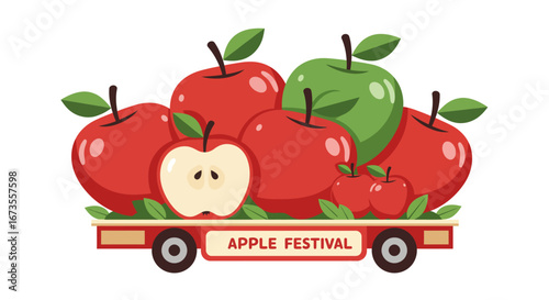 Apples on a red wagon labeled Apple Festival with a green apple amongst red ones